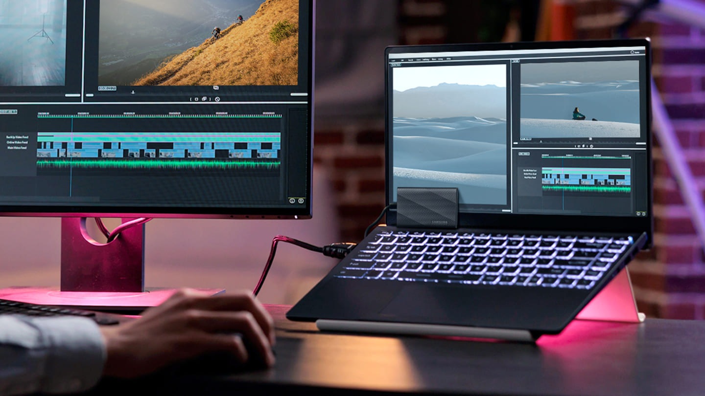 vn-feature-works-across-your-tech-setup-539527741 Một người đang chỉnh sửa video sau khi kết nối máy tính xách tay của mình với thiết bị T9.